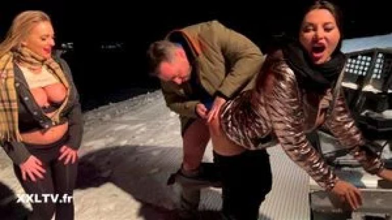 Nighttime ski slope threesome