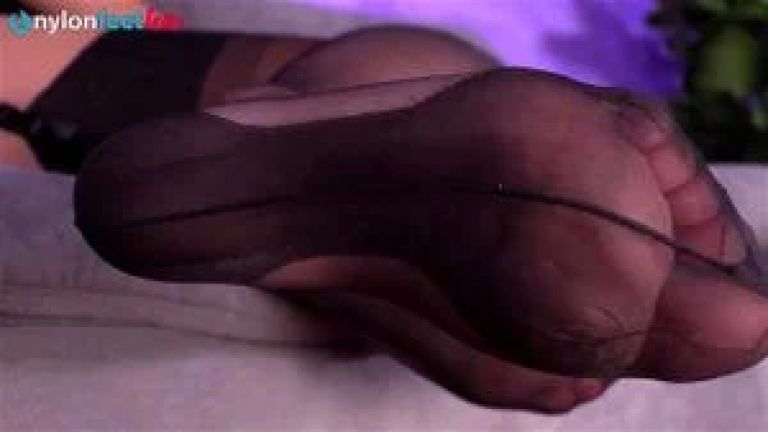Sexy  in cuban stockings pokes her feet in your face
