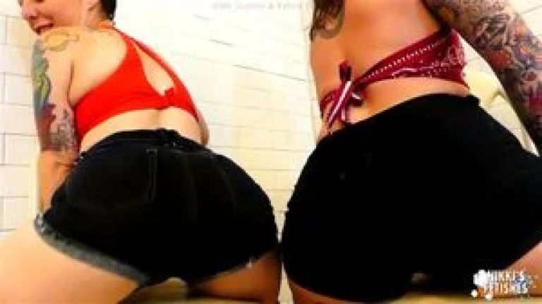 NIKKISFETISHES Two tattooed brunettes in lingerie pose together inside tiled bathroom