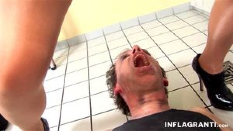 Fetish mistress peeing on slave's face